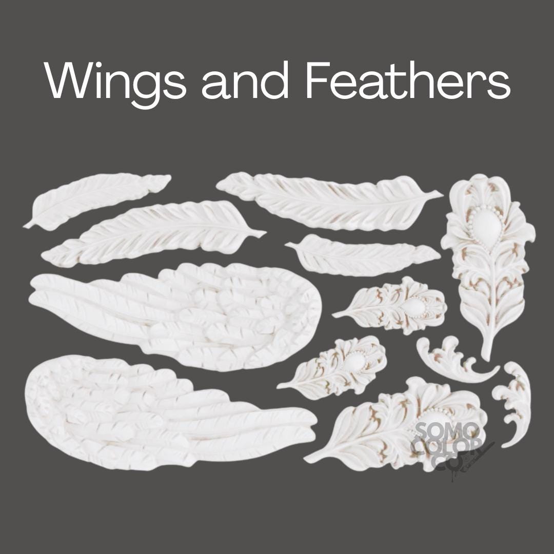 White wings and feathers on a gray background with 'SOMO' branding.